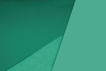 Dark and light, Plain and Textured Shades of green blue papers background lines intersecting to form a triangle shape