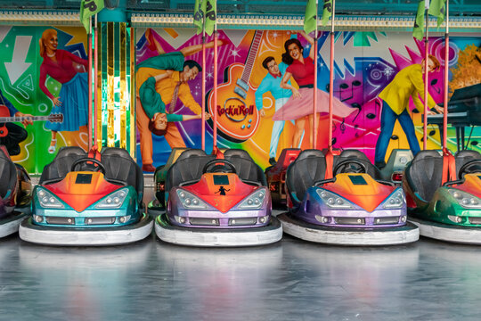D&uuml;sseldorf, NRW, Germany - 07 14 2022: bumper cars and dodgem cars waiting for drivers on the Dusseldorfer Rheinkirmes amusement park as big parish fair and kermis in Germany for fun and action cars
