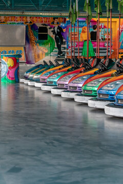 D&uuml;sseldorf, NRW, Germany - 07 14 2022: bumper cars and dodgem cars waiting for drivers on the Dusseldorfer Rheinkirmes amusement park as big parish fair and kermis in Germany for fun and action cars