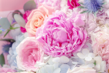 Obraz premium Wedding flower bouquet with peony and roses, blossom flower background