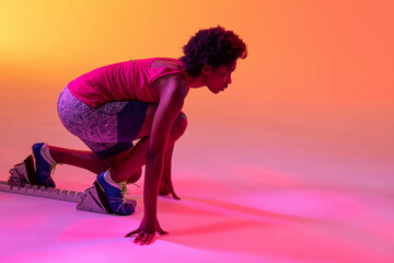 Image of african american female athlete preparing for run in neon orange and pink lighting