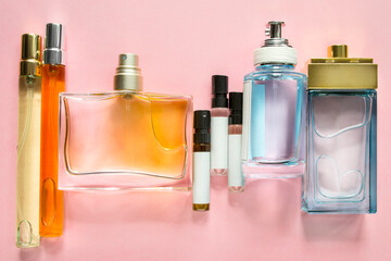 Perfume bottles on pink