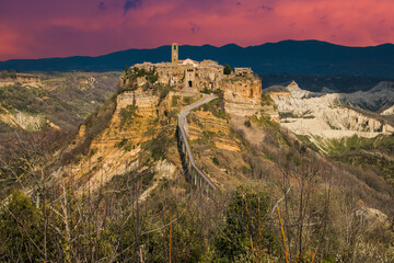 Fototapeta premium View of Civita di Bagnoregio during sunset, a picturesque hilltop village in Italy, is a popular day trip destination from Rome