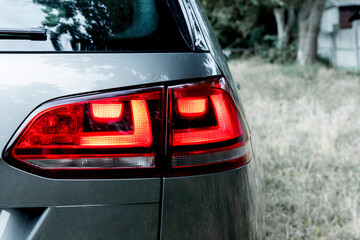 Rear headlights of a car Headlight of a car close-up.