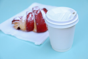 Concept of tasty breakfast with cup of coffee and croissant