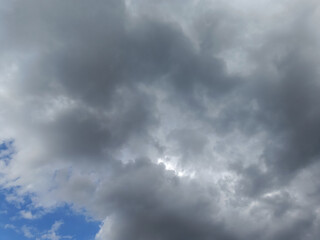 Dark clouds make the sky in black. The rain is coming soon.