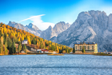 Fantastic sunny view of famous Misurina lake during autumn period