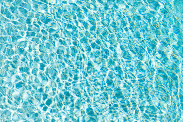 rippled water waves blue color in summer swimming pool