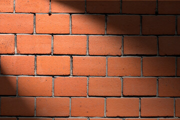 Old red brick wall with interesting shadow. Copy space for your design. Web banner. 