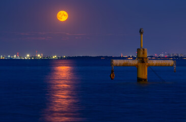 Full moon in July at Baltic Sea in Gdynia Orlowo. Poland