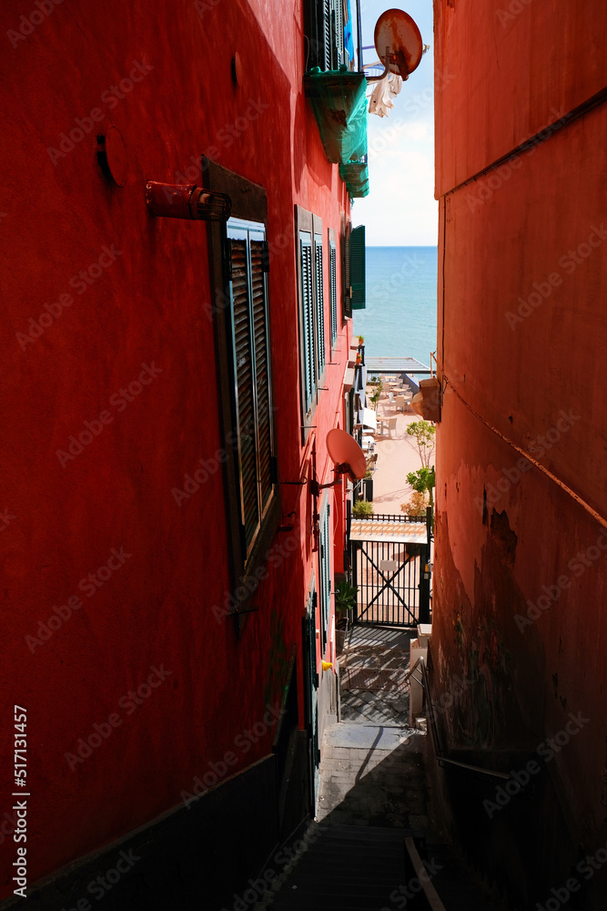 Poster Colorful picturesque narrow street in Naples, Italy, on Via Caracciolo, Mergelina Lungomare.