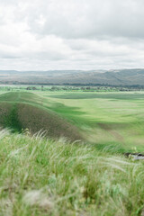 Naklejka premium mountains nature and green fields