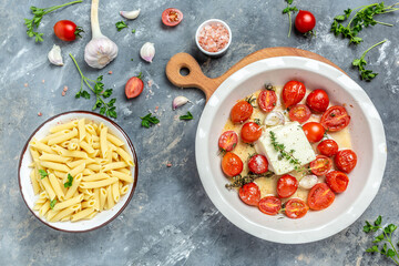 Trend Feta pasta recipe made of cherry tomatoes, feta cheese, garlic and herbs. cooking recipe ingredients, place for text, top view