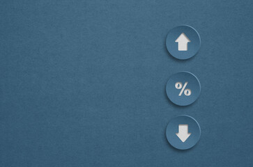 percentage to UP and Down arrow symbol icon on grunge blue paper cut with copy space. Interest rate, stocks, financial, ranking, mortgage rates and Cut loss concept