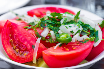 tomato salad with parsley, green pepper and garlic