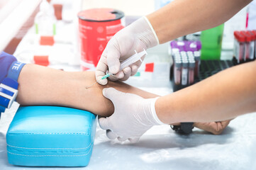 Obraz premium Close up hand of nurse, taking blood sample from a patient in the hospital. 