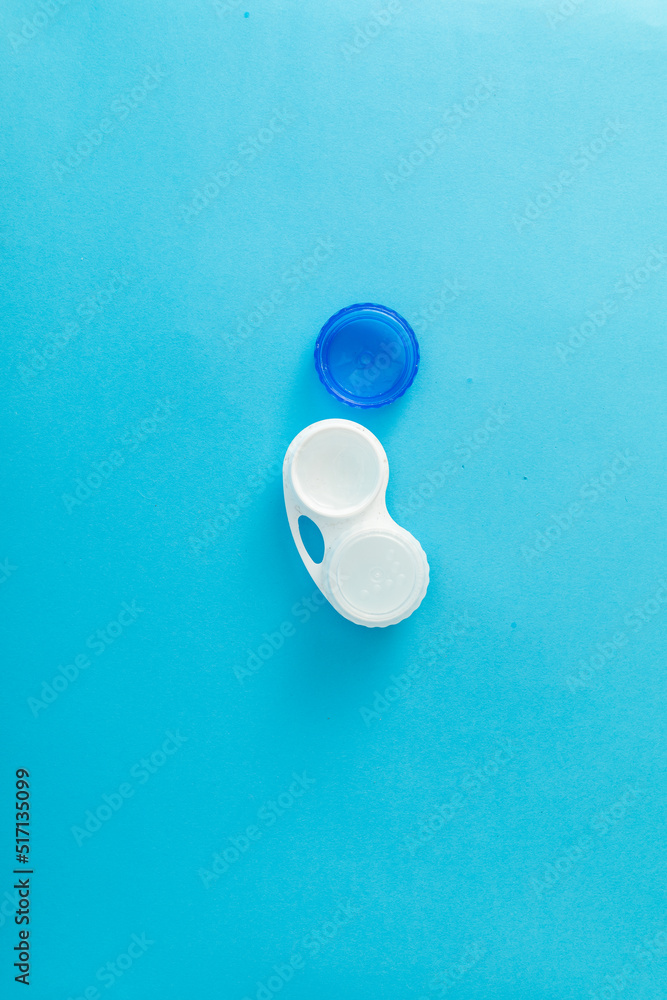 Wall mural eye lens case on blue background