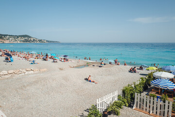 Nice, France-June 2022: life by The beautiful stone beach