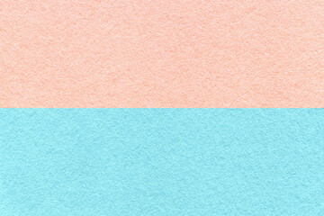 Fototapeta na wymiar Texture of craft light blue and pink paper background, half two colors, macro. Vintage dense rose cardboard.
