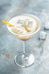 Classic daiquiri cocktail in glass on black background, Summer cold drink. cocktail allcohol. vertical image. top view. place for text