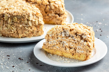 Meringue hazelnut cake with chocolate cream, Food recipe background. Close up. Layered cake