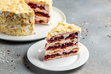 cake with cherries and white cream. delicious sweet dessert piece of cake