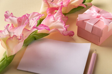 Greeting background with blossom flower and pink gift box, space for text