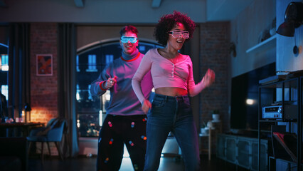 Stylish Diverse Multiethnic Couple in Casual Clothes and Futuristic Neon Glowing Glasses, Dance and...