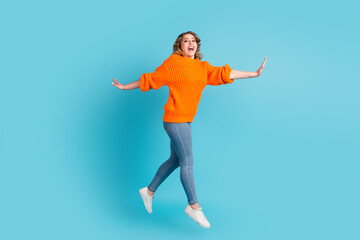 Fototapeta na wymiar Full size photo of cool brunette millennial lady jump isolated on green turquoise color background