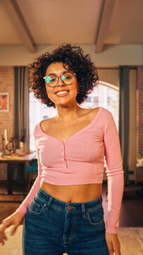 Vertical Screen: Beautiful Young Female Record a Dancing Routine on a Smartphone Video for Social Media. Stylish Black Girl in Glasses Streaming Her Choreography on Internet from Home.
