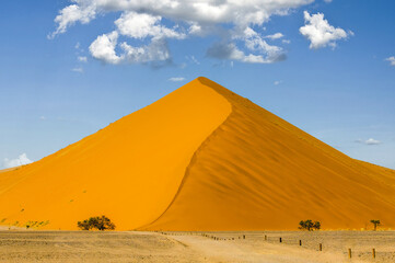 Fototapeta na wymiar Clouds over the sand dune in the Naukluft Namibia desert