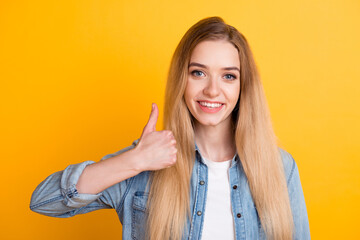 Young happy cheerful woman showing thumb up isolated bright color background