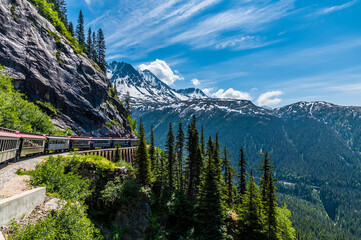 A view looking back from a train on the White Pass and Yukon railway on a bridge near Skagway,...