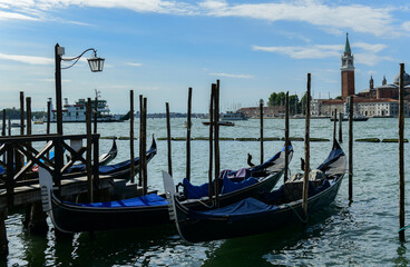 Fototapeta na wymiar Gondolas in Venice, Italy at dawn on the Grand Canal.