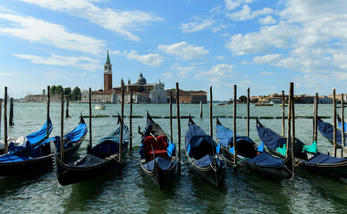 Fototapeta na wymiar Gondolas in Venice, Italy at dawn on the Grand Canal.