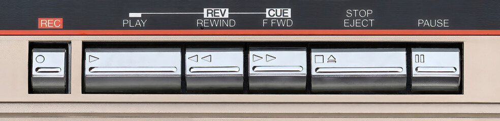 Close up of a retro tape deck buttons, record, play, fast forward, rewind, stop, eject and pause