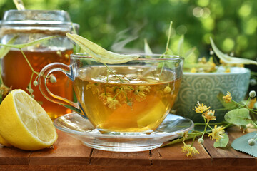 A glass of linden tea with lemon and honey