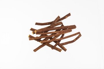 Close up of Ayurvedic herb Liquorice root,Licorice root, Mulethi or Glycyrrhiza glabra root on a wooden surface is very much beneficial for Soothes your stomach,poisoning, stomach ulcers.