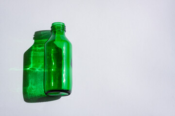 Green glass bottle with shadow and light effect	