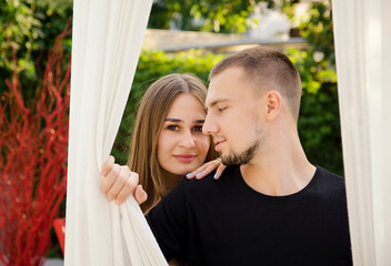 beautiful young couple g in summer sunny garden