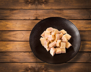 Chopped raw tripe on the plate - Rustic wooden background