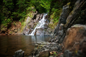 Fototapeta premium Waterfall in the Ukrainian Carpathians (Gorgany mountain range). Mountain watrefall colled Malyy Kuzmynets.