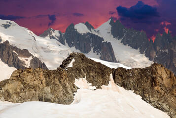 Mont Blanc Massif at twilight with Alpine afterglow in the summer season