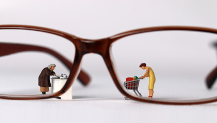 Business concept with glasses and miniature people.
