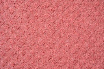 Panno spugna rosa da pulizia con rombi, vista superiore, macro