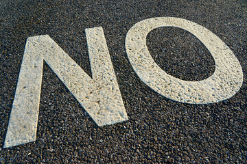 The word no written in large white letters