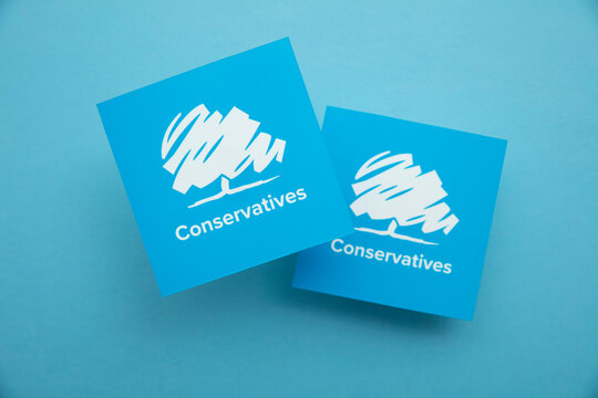 LONDON, UK - July 2022: Conservative United Kingdom Political Party Logo Against A Blue Background