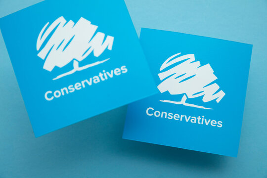 LONDON, UK - July 2022: Conservative United Kingdom Political Party Logo Against A Blue Background