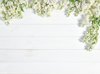White lilac flowers white washed wooden background