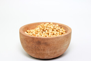 dry coriander seed spice on wood background